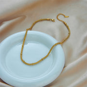 Elegant and niche design, hollowed out cylindrical chain, gold bead tassel pendant, titanium steel jewelry necklace